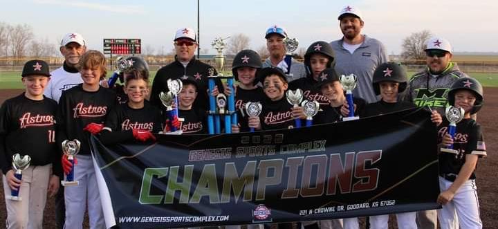 11/12U Astros hold up championship trophy and banner